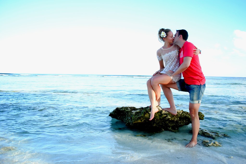 A couple on a tropical beach vacation — the envelope, won